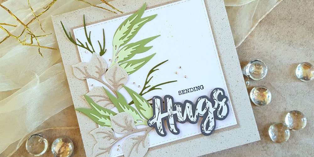 Spellbinders – Layered Foliage – Wasserzeichen 1 – 1000 Spellbinders - Layered Foliage - Hugs Expressions - Faltkarten.com - Graskarton - Design-Papier - Romantic Garden - Grusskarte